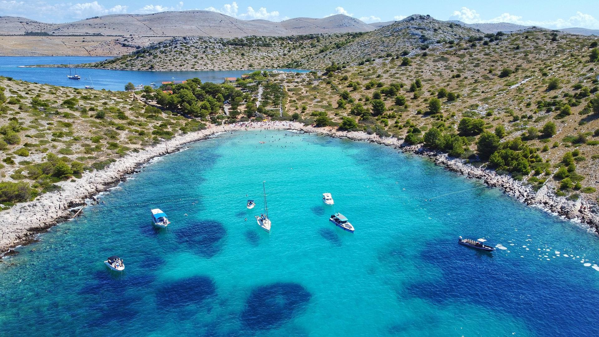 Anchored yacht in a secluded bay of the Elaphite Islands, perfect for sailing in Croatia